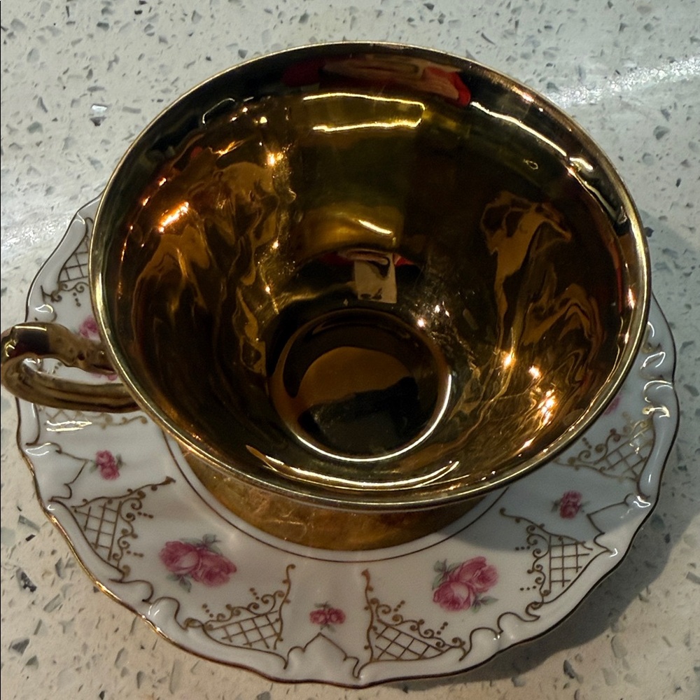 Elegant Gold and Floral Teacup and Saucer Set